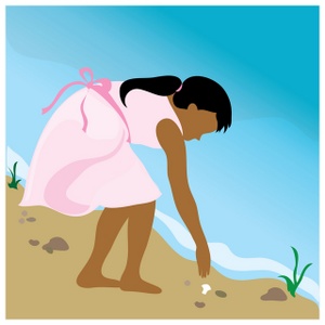 child on the beach collecting seashells